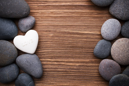 Spa stones in te wooden background.の写真素材