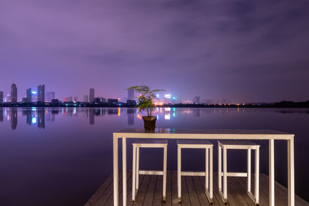 A city reflected by the lake at nightの写真素材