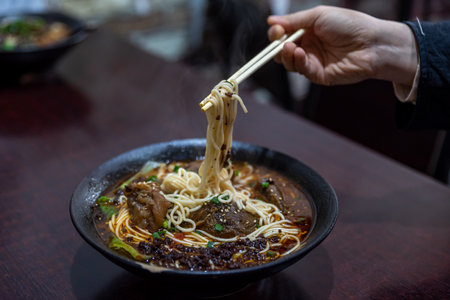 Pick up Chinese food with chopsticksの写真素材