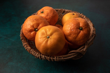 Whole or partial oranges in dark lightの写真素材