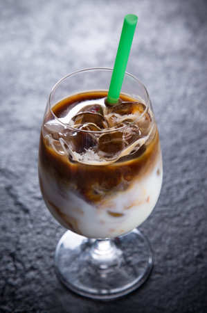 Ice coffee on bar desk, close-up.