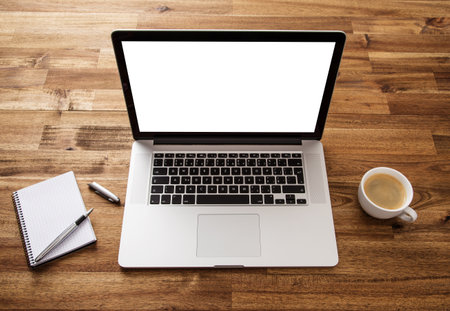 Workplace with notebook, office supplies and wooden desk.の写真素材