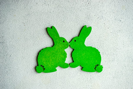 Easter card concept with bright colored wooden bunny as a holiday decorationsの写真素材