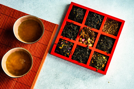 Tasty spring green tea in cups on stone tableの写真素材