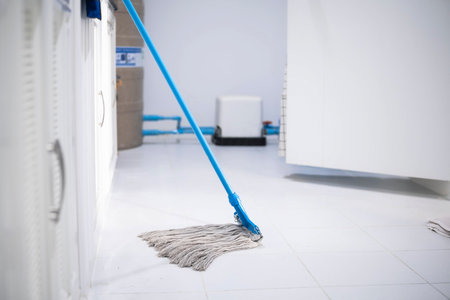 Asian man inspection cleaning staff in kitchen, bathroom blurry background Metaphor for cleaning Get rid of germs In bathroom, home office.For reliability And satisfaction of service and customers.の写真素材