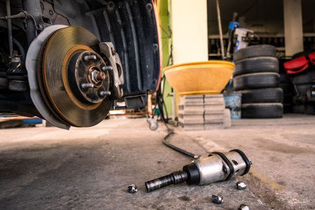 Red car in station repair service car maintenance for industry rubber wheels tire vehicle auto car change garage repairing problem transport automobile service automotive maintenance.の写真素材