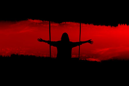 girl with hands aside on bloody sky background. Young, beautiful, girl on colorful a sunset background.の写真素材