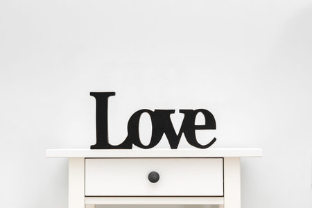 cut out wood letter. Letters LOVE on a white backgroundの写真素材