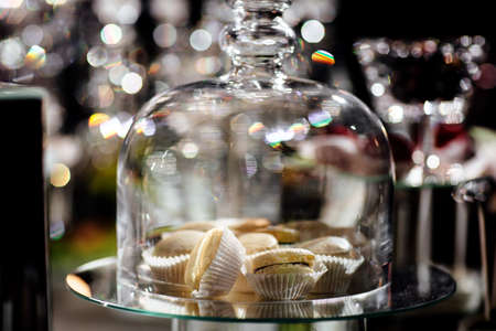 Chocolate macaroons cakes on a black backgroundの写真素材