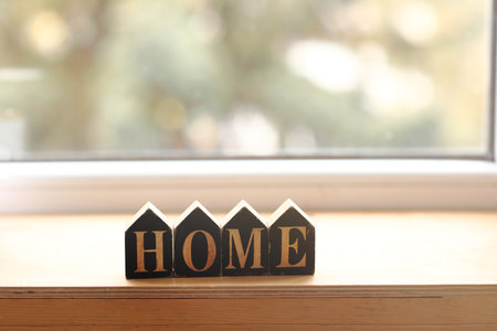 Still life home decor in a cozy house with wooden letters with the inscription home. The concept of decor and comfort. selective focus.の写真素材