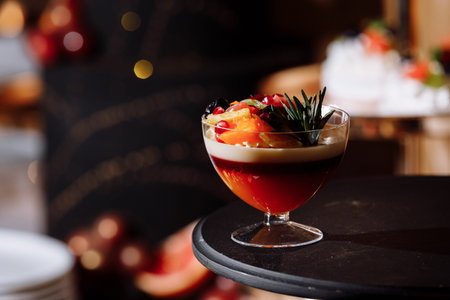 Colorful table with sweets and goodies for the wedding party reception, decoration dessert table. Delicious sweets on candy buffet. Dessert table for a party. cakes, cupcakesの写真素材