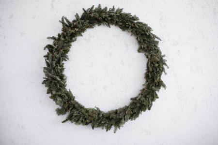 Christmas big wreath is Isolated on a stone white backgroundの写真素材