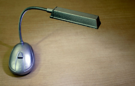 desk lamp on wood table backgroundの写真素材