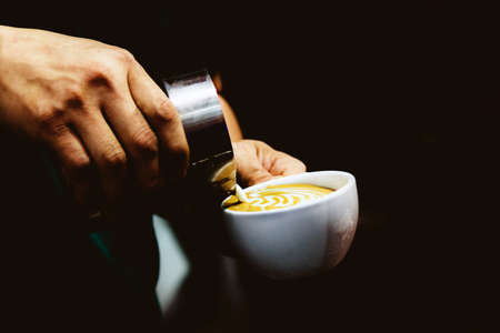 Barista working in a coffee shop, Close up of barista presses ground coffee using tamper, Barista Make Coffee Portafilter Conceptの写真素材