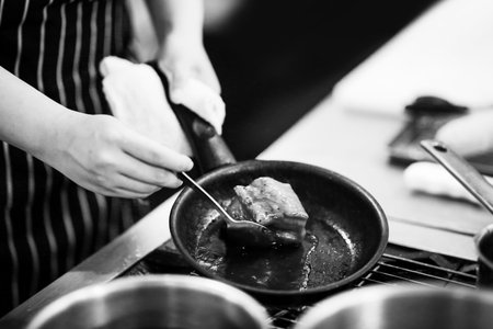 chef preparing food, chef cooking in a kitchen, chef at work, Black & Whiteの写真素材