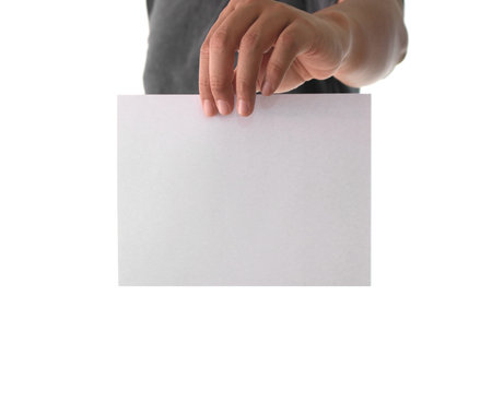 Hand holding white empty paper