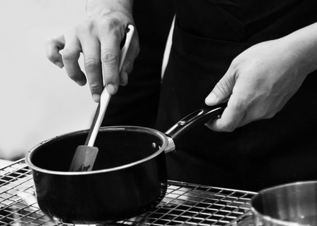 chef preparing food, chef cooking in a kitchen, chef at work, Black & White
