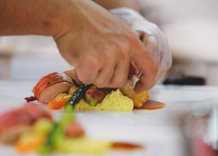 Chef preparing food, meal, in the kitchen, chef cooking, Chef decorating dishの写真素材