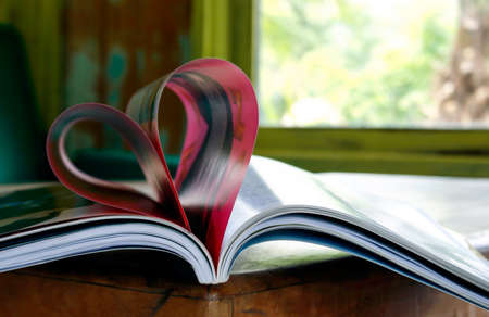 Heart from book pages in blurred backgroundの写真素材