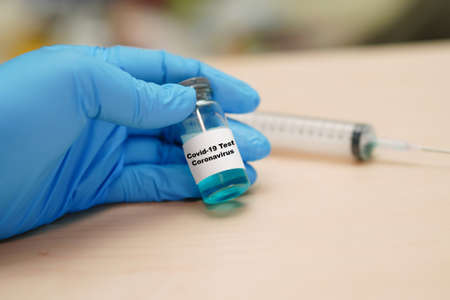 Coronavirus Covid-19 vaccine development medical with syringe for doctor use to treat pneumonia illness patients.の写真素材