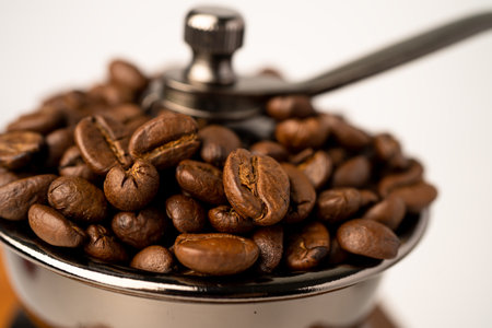 Coffee bean roasted in wooden grinder.