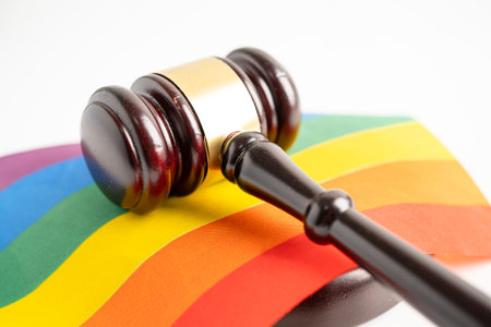 Gavel for judge lawyer on rainbow flag, symbol of LGBT pride month celebrate annual in June social of gay, lesbian, bisexual, transgender, human rights.の写真素材