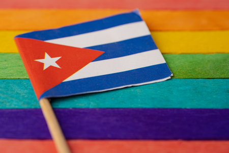 Cuba flag on rainbow background flag symbol of LGBT gay pride month social movement rainbow flag is a symbol of lesbian, gay, bisexual, transgender, human rights, tolerance and peace.の写真素材
