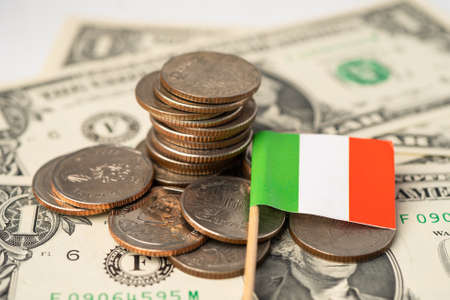 Stack of coins with Italy flag on white background.の写真素材