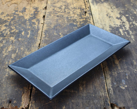 Empty dish plate on wooden background