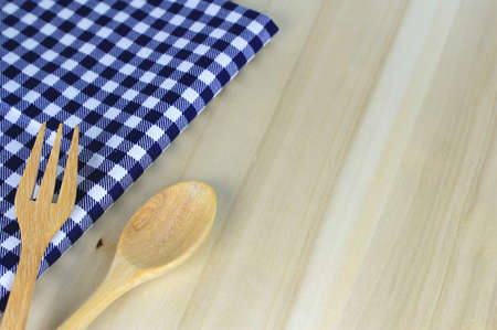 fork and spoon on tablecloth for food serving backgroundの写真素材