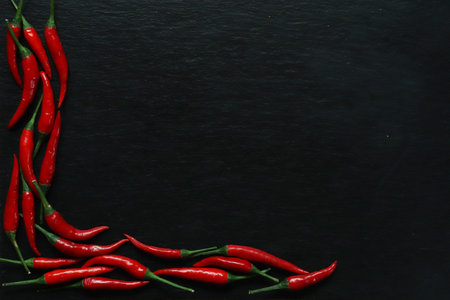 Photography of red hot peppers on slate background for restaurant menu