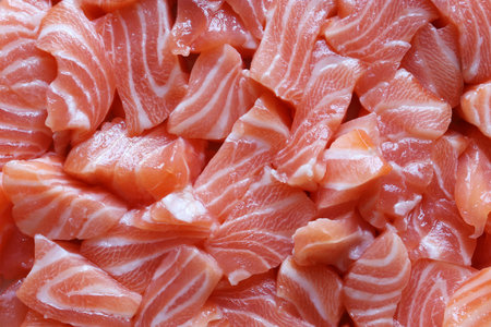 Photography of salmon fillet cut into small pieces for food background