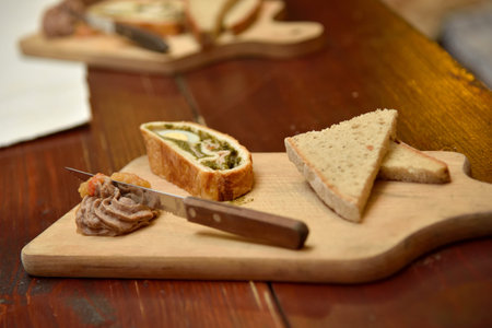 Sandwiches with homemade chicken liver pate for breakfast on wooden cutting boardの写真素材