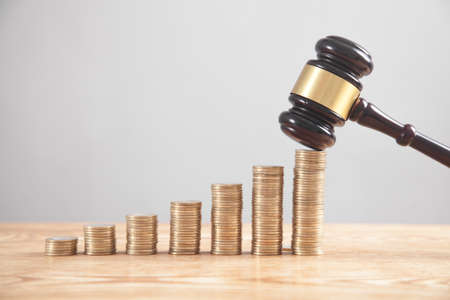 Stack of coins with judge gavel.の写真素材