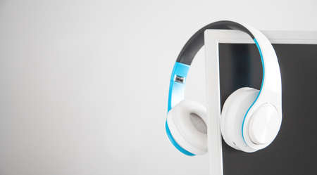 White headphones with a computer screen.の写真素材