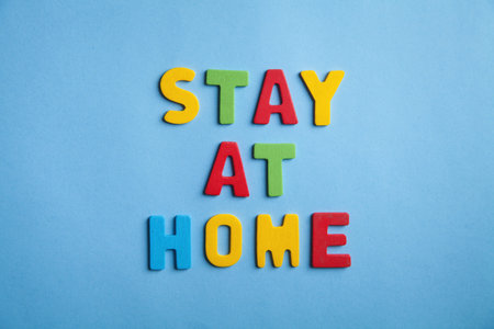 Colorful word Stay at home on the blue background.