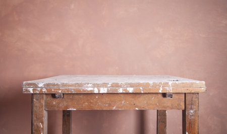 Old table. Room before renovation. Wall background