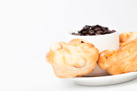 Roasted coffee beans in a glassの写真素材