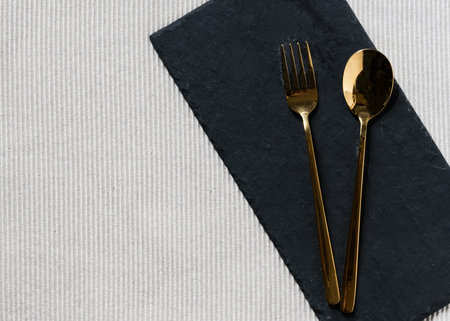 Empty plate with silver fork and Spoon dining dish, copy space