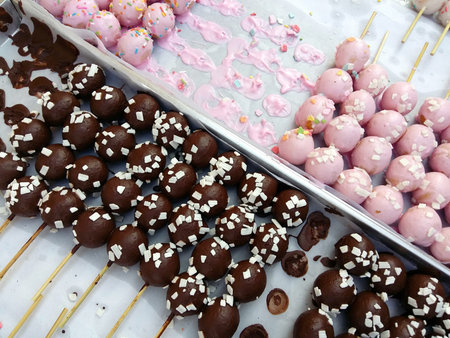 Sweet donut balls piled on a white plate
