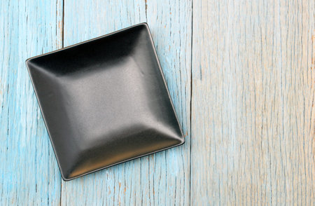 plate on wood table background