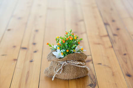 Vase of flowers in a brown bag.の写真素材