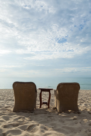 Chairs and tables on the beachの写真素材