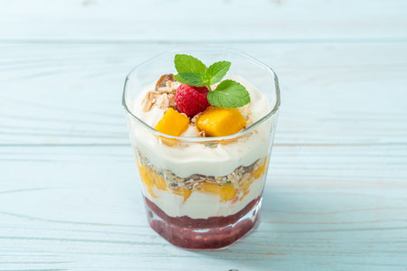 homemade mango and raspberry with yogurt and granola