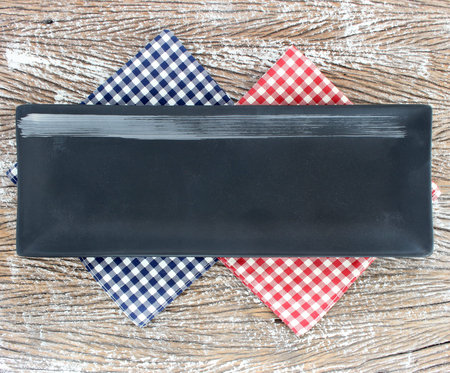 Empty modern ceramic plate on wood table background ,top view