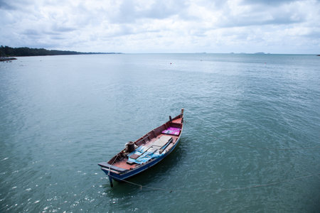 Fishing boats moored at sea.の写真素材