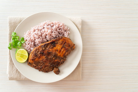 spicy grilled Jamaican jerk chicken with riceの写真素材