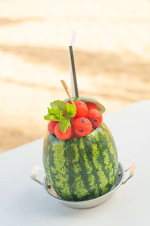 watermelon smoothies with sea beach backgroundの写真素材