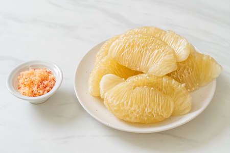 Fresh peeled pomelo, grapefruit or shaddockの写真素材