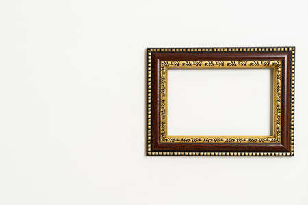 empty picture frame on white wall backgroundの写真素材